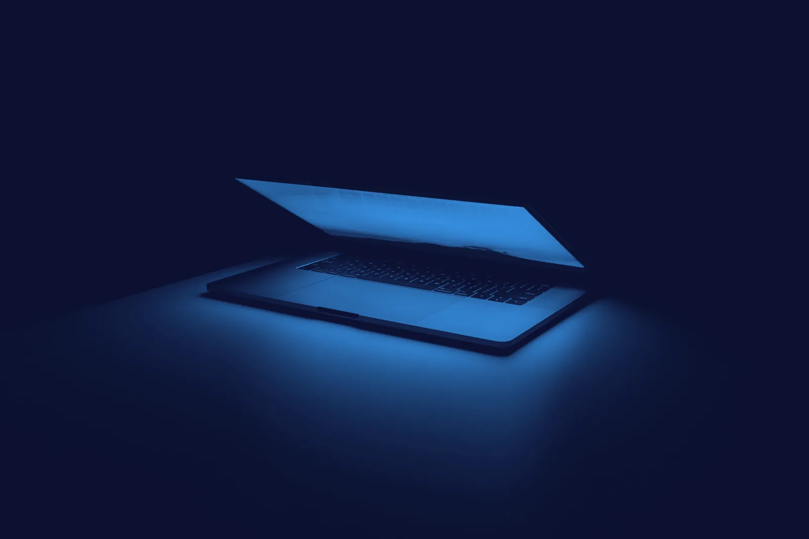 Blue-on-ink duotone photograph of a laptop glowing in the dark, the hero image of the sample TechDailyBrief review.